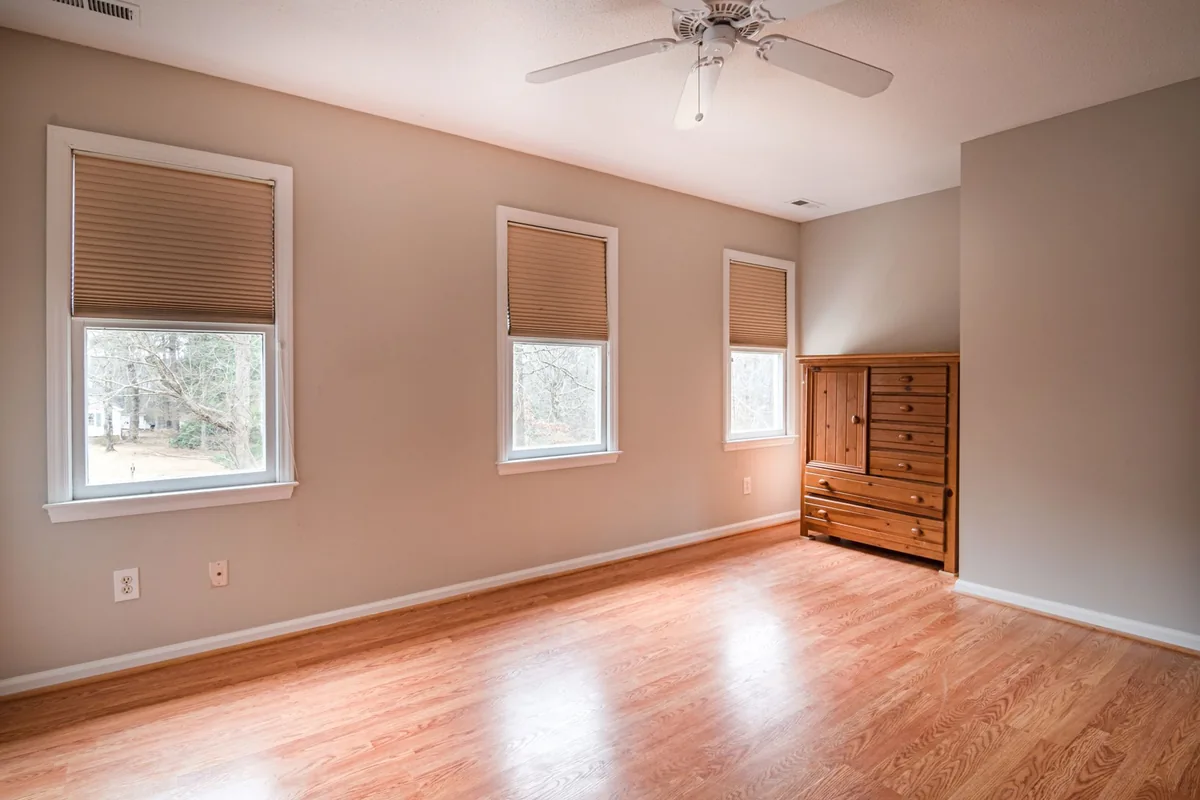 A mostly empty room with natural light and clear floors.
